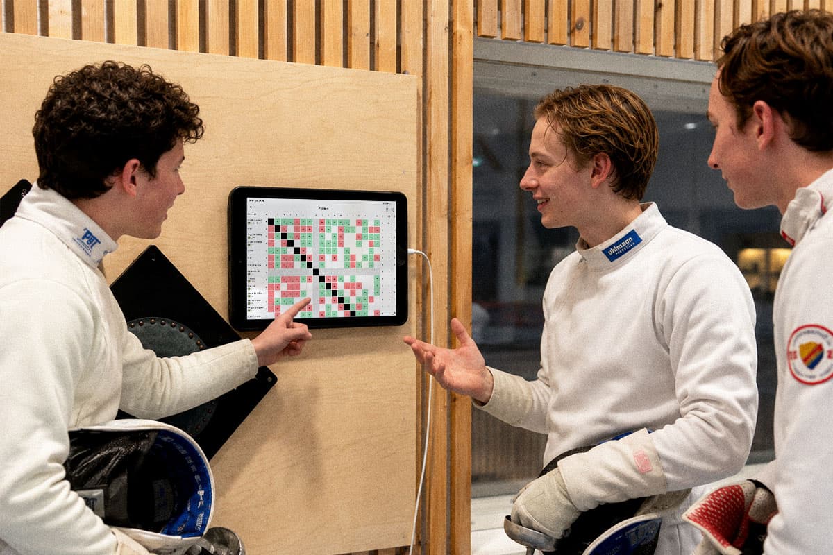 Competition results in Fencer alongside a hand-written pool sheet